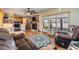 Open-concept living room with modern decor and easy access to kitchen at 37235 Cora Ave, Zephyrhills, FL 33542