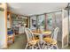 Cozy sunroom with a dining table set, perfect for enjoying meals with natural light at 37235 Cora Ave, Zephyrhills, FL 33542