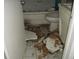 Interior bathroom showing severe damage and destruction of the walls and ceiling at 390 Belle Point Dr, St Pete Beach, FL 33706