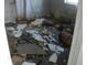 Damaged bedroom featuring severe structural and cosmetic damage throughout the room at 390 Belle Point Dr, St Pete Beach, FL 33706