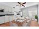 Bright kitchen with white cabinetry, modern appliances, and a dining area perfect for Gathering meals at 4228 La Dega Ct, Tampa, FL 33611