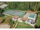 Aerial view of community amenities, including tennis courts and a refreshing swimming pool at 440 Pendleton Dr, Venice, FL 34292