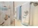 Up close detailed view of decorative seashell bath towels with themed shower curtain at 440 Pendleton Dr, Venice, FL 34292