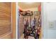 Walk-in closet with clothes, guitar cases, storage, and filing cabinets, providing ample storage solutions at 440 Pendleton Dr, Venice, FL 34292