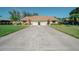 Charming single-story home with a well-manicured lawn and spacious driveway, perfect for comfortable living at 440 Pendleton Dr, Venice, FL 34292