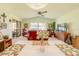 Bright living room featuring vaulted ceilings, fan and a large window to let in plenty of natural light at 440 Pendleton Dr, Venice, FL 34292