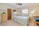 Well-lit bedroom with a comfortable bed, neutral tones, and ample natural light from the window at 440 Pendleton Dr, Venice, FL 34292