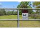 Gated property with livestock and warning sign, perfect for animal lovers at 4508 Spring Rd, Valrico, FL 33596