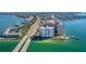 Breathtaking aerial view of waterfront condos, bridge, and coastline offers a glimpse of the desirable location at 5220 Brittany S Dr # 1403, St Petersburg, FL 33715