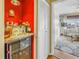 Built-in bar area with a wine cooler and glassware storage, leading to a sitting room with a view at 5220 Brittany S Dr # 1403, St Petersburg, FL 33715
