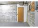Unfinished basement with concrete block walls and door at 5220 Brittany S Dr # 1403, St Petersburg, FL 33715