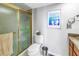 Bathroom with tile floor, shower stall with gold trim, and marble sink at 5220 Brittany S Dr # 1403, St Petersburg, FL 33715