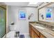 Bathroom featuring granite countertops, a large mirror, and tiled floors at 5220 Brittany S Dr # 1403, St Petersburg, FL 33715