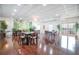 Well-lit dining room featuring glossy hardwood floors, tropical mural, recessed lights, and simple ceiling fans at 5220 Brittany S Dr # 1403, St Petersburg, FL 33715