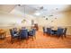 Bright game room featuring two round tables with poker-themed pendant lights and cushioned, blue rolling chairs at 5220 Brittany S Dr # 1403, St Petersburg, FL 33715
