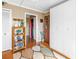 Hallway with wood floors, leaf rug, shelving unit, and white closet at 5220 Brittany S Dr # 1403, St Petersburg, FL 33715