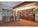 Well-stocked library with full bookcases and comfortable seating around a small, central table at 5220 Brittany S Dr # 1403, St Petersburg, FL 33715