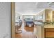 Spacious open-plan living area with hardwood floors, neutral tones, and an adjacent dining space at 5220 Brittany S Dr # 1403, St Petersburg, FL 33715