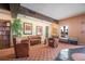 Comfortable lounge with plush leather seating, stylish artwork, and a view of the pool at 5220 Brittany S Dr # 1403, St Petersburg, FL 33715