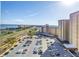 Expansive parking lot with ample parking for residents and guests; coastal skyline in the background at 5220 Brittany S Dr # 1403, St Petersburg, FL 33715