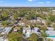 Aerial view of the property showcasing a pool, fenced yard, landscaping and the surrounding neighborhood at 5314 13Th S Ave, Gulfport, FL 33707