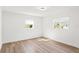 Bright bedroom with natural light, featuring modern flooring and a clean aesthetic at 5314 13Th S Ave, Gulfport, FL 33707