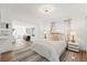 Bright and inviting bedroom boasts natural light and warm wood floors, providing a comfortable and stylish retreat at 5314 13Th S Ave, Gulfport, FL 33707
