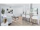 Open-concept living space with modern decor, light wood floors, and seamless flow at 5314 13Th S Ave, Gulfport, FL 33707