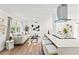 Bright living area featuring a kitchen island with seating, a comfortable sofa, and contemporary decor for relaxation and entertaining at 5314 13Th S Ave, Gulfport, FL 33707
