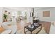 Open-concept living space with a modern kitchen island, contemporary decor, and seamless flow for entertaining and relaxation at 5314 13Th S Ave, Gulfport, FL 33707