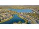 Aerial view showcasing the community's beautiful lake and well-maintained homes at 5412 Olano St, Palmetto, FL 34221