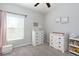 Neutral Bedroom with soft gray carpet, dresser, and a changing table at 5412 Olano St, Palmetto, FL 34221