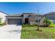 Charming single-story home with well-maintained lawn and attached two-car garage at 5412 Olano St, Palmetto, FL 34221
