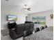 Cozy living room features a ceiling fan, large window, and comfortable seating at 5412 Olano St, Palmetto, FL 34221