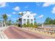 Charming entrance to Little Harbor community with palm trees and lush landscaping at 545 Bahia Beach Blvd, Ruskin, FL 33570