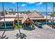 Aerial view of waterfront restaurant with tropical thatched roof and inviting outdoor seating at 545 Bahia Beach Blvd, Ruskin, FL 33570