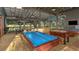 Community game room featuring pool tables, foosball and large windows overlooking the property at 5728 Skytop Dr, Lithia, FL 33547