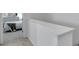 Hallway view with bedroom; neutral wall color and gray carpet at 5728 Skytop Dr, Lithia, FL 33547