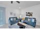 Comfortable living room featuring matching sofas, decor, and modern ceiling fan at 5728 Skytop Dr, Lithia, FL 33547