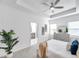 Spacious main bedroom with tray ceiling, carpeted floors, and light neutral tones at 5728 Skytop Dr, Lithia, FL 33547