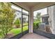 A screened patio overlooking a landscaped backyard and neighboring houses at 5728 Skytop Dr, Lithia, FL 33547