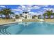 Large community pool with sun loungers and landscaped surroundings at 5728 Skytop Dr, Lithia, FL 33547
