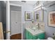 Bathroom featuring a colorful vanity, glass bowl sink and mosaic backsplash at 5840 30Th S Ave # 305, Gulfport, FL 33707