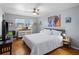Bright bedroom with a comfortable bed, ceiling fan, and ample natural light at 5840 30Th S Ave # 305, Gulfport, FL 33707