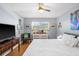 Bright bedroom with a comfortable bed, ceiling fan, and ample natural light at 5840 30Th S Ave # 305, Gulfport, FL 33707