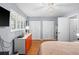Bright bedroom features hardwood floors, shuttered windows, and spacious closets at 5840 30Th S Ave # 305, Gulfport, FL 33707