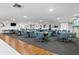 Spacious community room with many tables, blue chairs, and a mural on the wall at 5840 30Th S Ave # 305, Gulfport, FL 33707