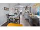 Charming dining area and open concept kitchen with stylish black table and designer decor at 5840 30Th S Ave # 305, Gulfport, FL 33707