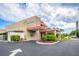 A building with nice landscaping, marked as Town Shores with ample parking and a circular driveway at 5840 30Th S Ave # 305, Gulfport, FL 33707
