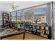 Inviting home office featuring large windows, ceiling fan, and ample shelving at 5840 30Th S Ave # 305, Gulfport, FL 33707